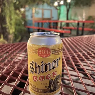 a can of beer on a table