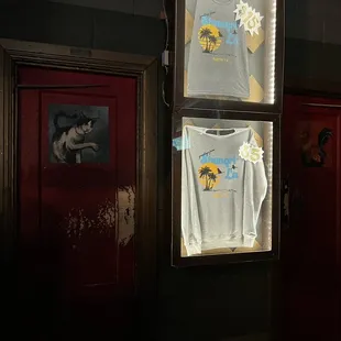 a t - shirt hanging in a window