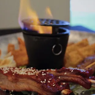 a plate of food with meat and fries