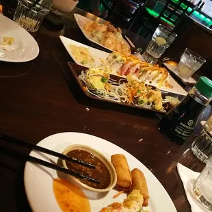 plates of food on a table with chopsticks