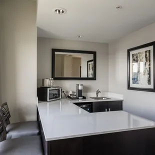 Spacious one bedroom corner suite offers a kitchenette with nice bar