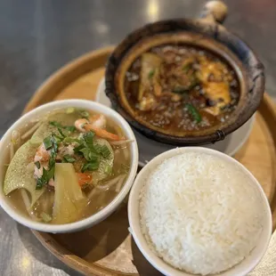 Brazed caramelized catfish in a clay pot with sweet and sour prawn soup.