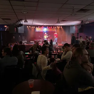 a crowd of people sitting at tables