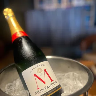 a bottle of champagne in a bucket