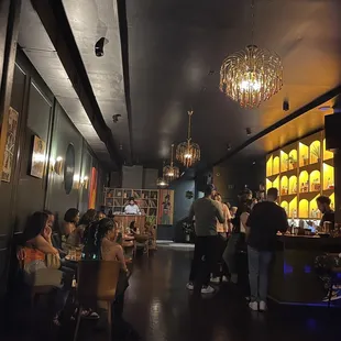 people sitting at tables in a restaurant