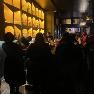 people sitting at a bar