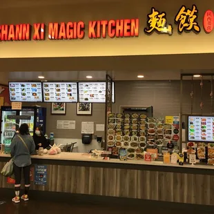 a woman standing in front of the counter