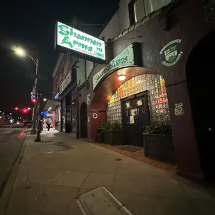 the entrance to a restaurant at night