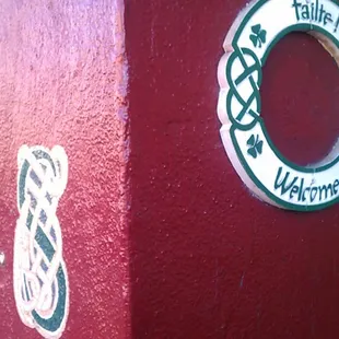 a red building with a sign on it