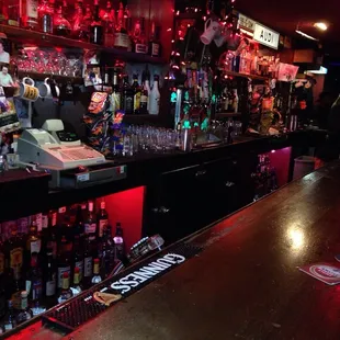 a bar filled with bottles of alcohol