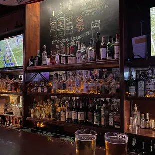two glasses of beer on the bar