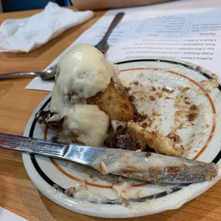 What&apos;s left of an AMAZING cinnamon roll with WARM cream cheese icing!!!