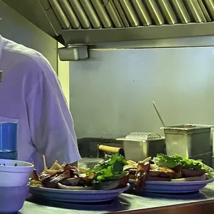 a man preparing food in a kitchen