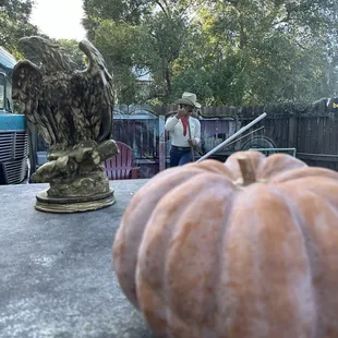 a pumpkin and an owl statue