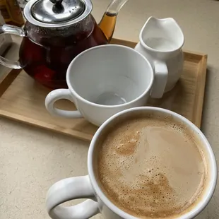 A pot of tea and a latte
