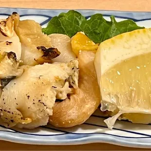 a piece of lemon on a plate