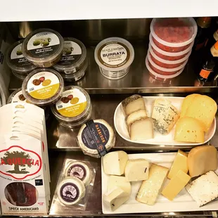 a variety of cheeses on display