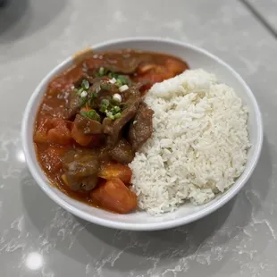 a bowl of rice and beef