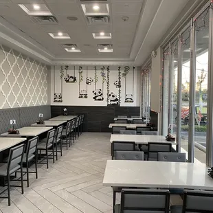 a dining area with tables and chairs