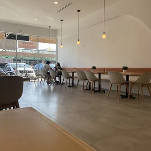 two people sitting at a table in a coffee shop