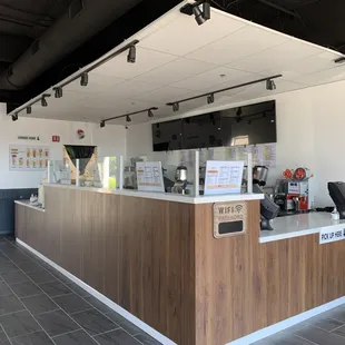 a coffee shop counter with coffee machines