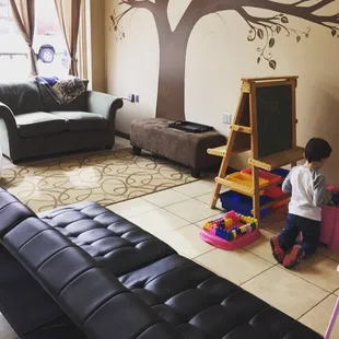 Play area where mommies can sit drink coffee and still see their little ones