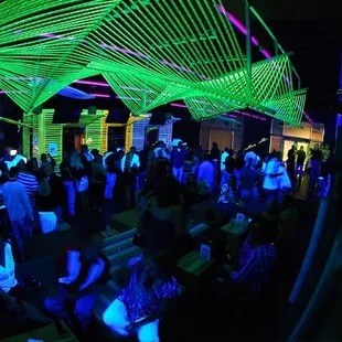 a large group of people in a dark room