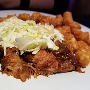 Pulled Pork (minus the bun) topped with coleslaw and a side of tater tots