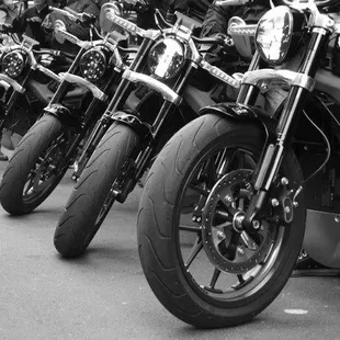 a row of motorcycles parked on the street