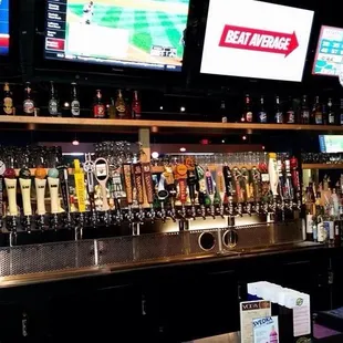 a bar with many different types of beer