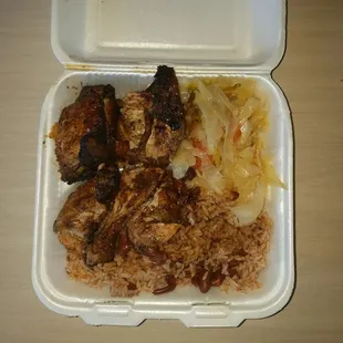 Jerk Chicken, cabbage, and red beans and rice...almost bit my finger it was so good!