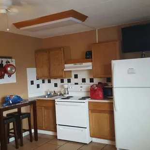Kitchenette, that I won&apos;t use after seeing a roach in the cabinet while following the microwave cord rigged up into the cabinet. :(
