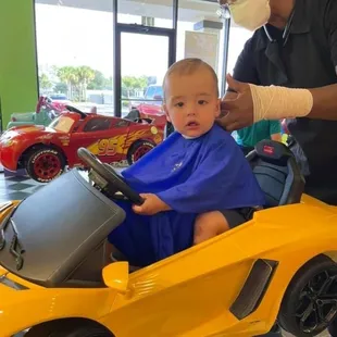 Haircut in one of our toy cars