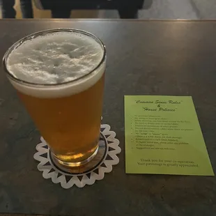 a glass of beer on a table