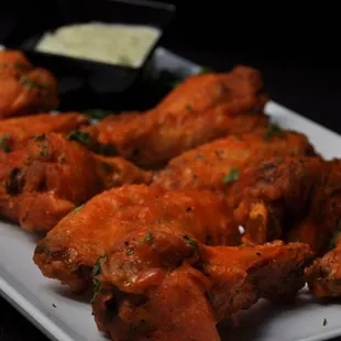 a platter of chicken wings