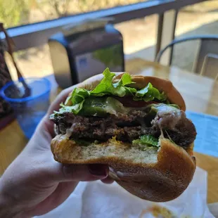 I told my wife to open her mouth wider, but she couldn't. Try as she might, she was unable to fit it all in.