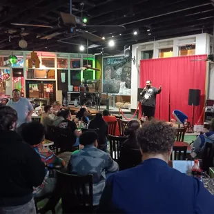 a crowd of people sitting at tables