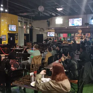 a crowd of people sitting at tables