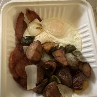 Two eggs, bacon, Portuguese sausage, house fries