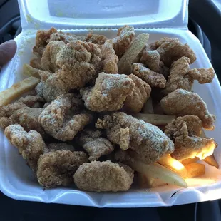 a tray of fried fish and fries