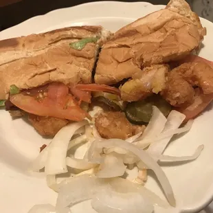 One half of the sorry excuse of a Shrimp Po Boy with a gang of onions picked out that were supposed to not be on the sub.
