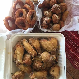 Garlic Parmigian wings, fried mushrooms &amp; onion rings.