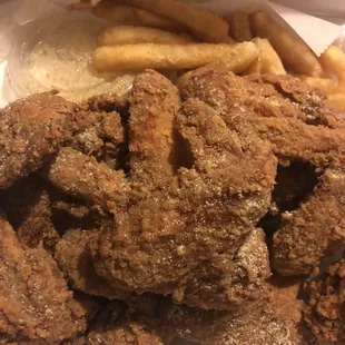 a pile of fried fish and fries