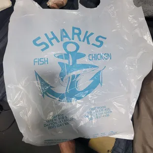 a person holding a plastic bag