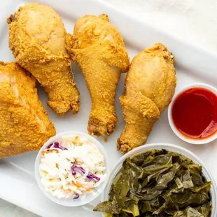 Fried Chicken (legs and thighs) and collard green/coleslaw with a side of mumbo sauce