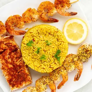 Grilled Salmon and Skewered Shrimp platter with Cajun rice