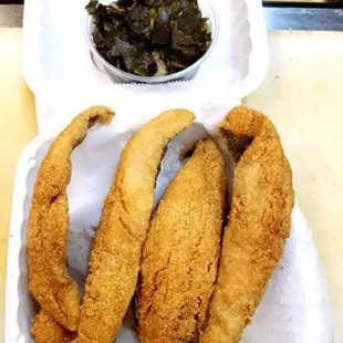 a tray of fish and vegetables