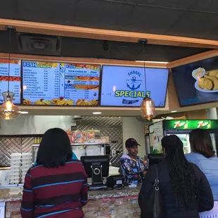 people ordering food at a restaurant