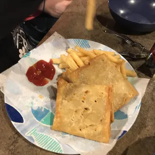 a plate of food with fries and ketchup