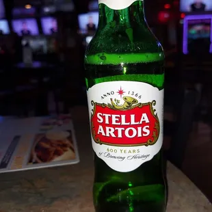 a bottle of beer on a table